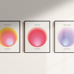 May include: Three framed prints with colorful gradient circles and inspirational text. The first print says "What you think, You will create." The second print says "What you feel, You will attract." The third print says "What you imagine, You will become."