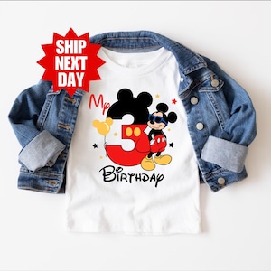 May include: White t-shirt with a red number 3 and a cartoon image of Mickey Mouse wearing sunglasses. The text "My 3rd Birthday" is printed below the image.