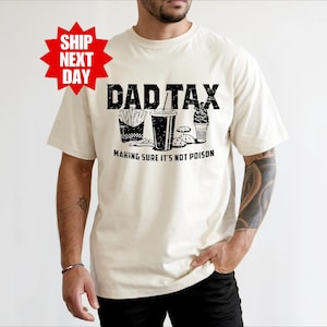 a man wearing a dad tax t - shirt