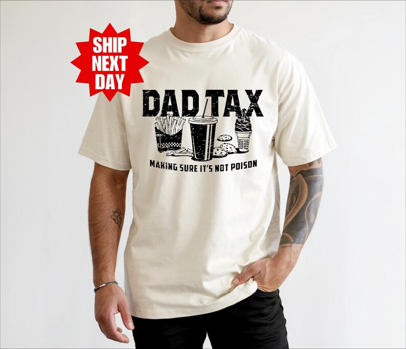 a man wearing a dad tax t - shirt