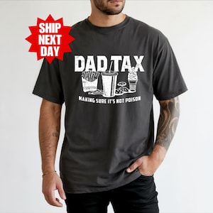 a man wearing a shirt that says dadtax making sure it's not