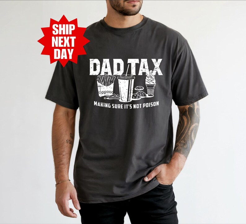 a man wearing a shirt that says dadtax making sure it's not