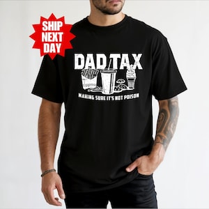 a man wearing a black shirt with the words dadtax on it