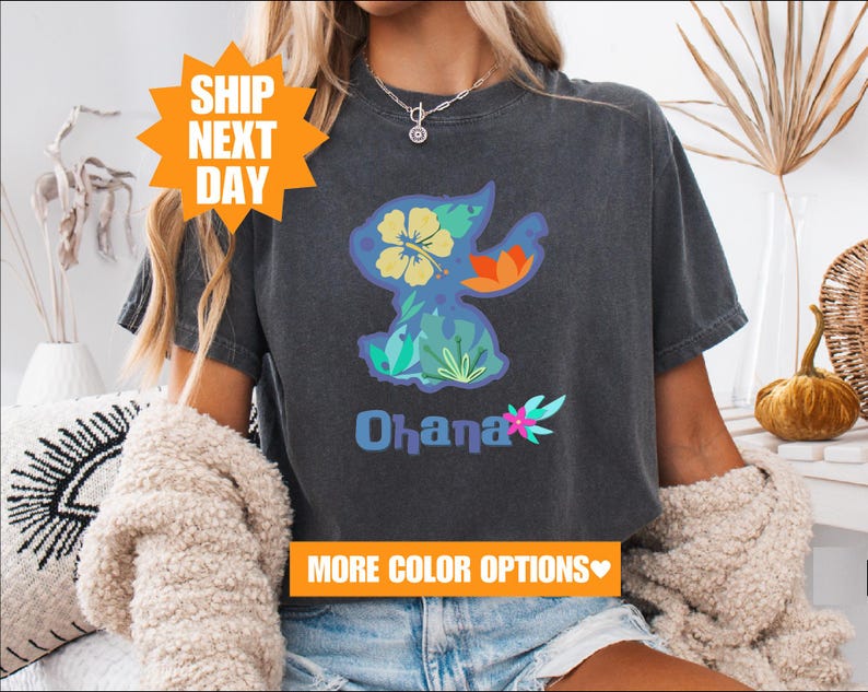 a woman wearing a black shirt with the word ohana on it
