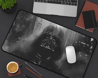 May include: Black and white mousepad featuring a close-up of Darth Vader's helmet in a rainy city setting.