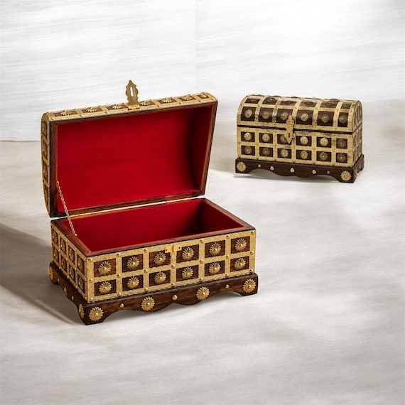 A genuinely hand-crafted wooden treasure chest with aged brass hardware — the kind of statement storage piece that makes a room look like it belongs in a seafarer's study.