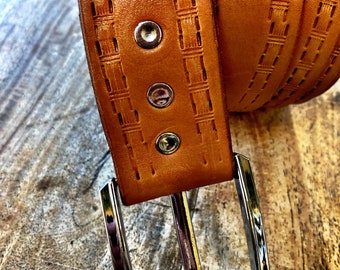 Tan embossed leather belt.