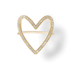 May include: A gold heart-shaped ring with a diamond-encrusted outline.