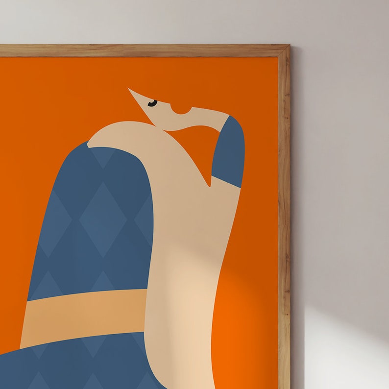 May include: Abstract art print depicting a seated figure. The artwork has a bright orange background with a figure in blue, beige, and tan tones. The figure's clothing features a diamond pattern. The print is framed in a wooden frame.