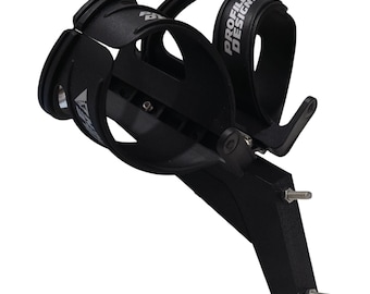 May include: Black Profile Design bicycle water bottle cage with the brand name printed in white. The cage is designed to hold a water bottle and is mounted on a black bracket with two screws.