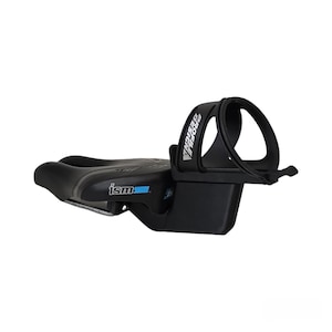 May include: Black bicycle saddle with a built-in water bottle cage. The saddle has the brand name "ism" in white and blue. The water bottle cage is black and has the brand name "Profile Design" in white.