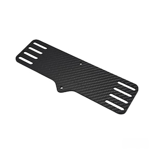 May include: A black carbon fiber plate with a rectangular shape and rounded edges. The plate has multiple rectangular cutouts along the top and bottom edges. Two small holes are visible near the center.