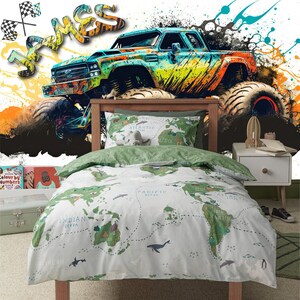 May include: A green and orange monster truck with the name "James" written in graffiti style on the wall behind it. The truck is driving over a world map printed on a white and green duvet cover.