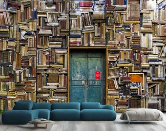 May include: A teal blue door with a weathered wood frame, set against a wall of stacked books. The books are arranged in a random pattern, creating a unique and interesting texture. The door is closed and has a simple design.