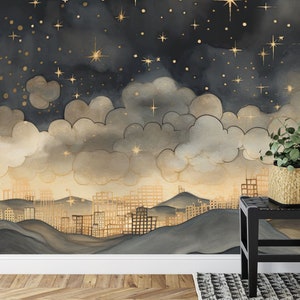 May include: A watercolor painting of a city skyline with gold stars and clouds against a dark blue background. The city is depicted as a series of gold buildings on rolling hills.