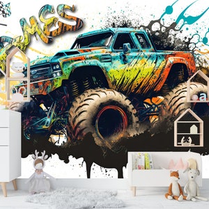 May include: A colorful monster truck with the word "James" written in graffiti style on a white background with black splatters of paint.