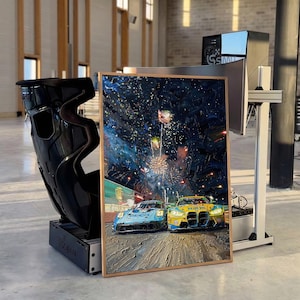 May include: An oil painting in a wooden frame depicts two race cars speeding on a track under a night sky filled with fireworks. A black racing seat and a computer monitor are also in the image.