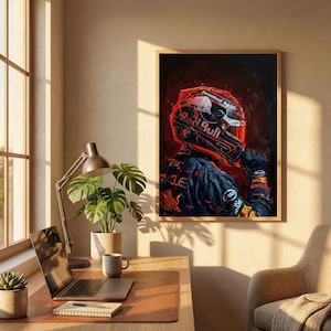 May include: A framed artwork featuring a Formula 1 driver in a Red Bull racing suit and helmet. The artwork is dominated by red and blue hues, with the Red Bull logo prominently displayed on the helmet and suit. The image has a dark, artistic style.