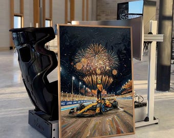 May include: An oil painting in a wooden frame depicts a Formula 1 race car with a driver celebrating under fireworks. The car is yellow and blue. A black racing seat and a computer monitor are also in the image.