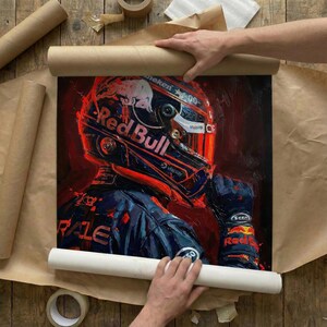 May include: An oil painting of a race car driver in a Red Bull helmet and uniform. The artwork is predominantly red, navy, and white, with the Red Bull logo prominently displayed. The painting is being carefully rolled in brown paper.