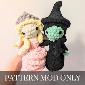 May include: Two handmade crochet dolls: a princess in a pink dress and a green-faced witch in a black outfit. The princess has blonde hair and a gray crown. The witch wears a black hat. The text "PATTERN MOD ONLY" is at the bottom.