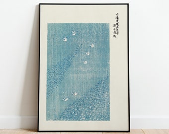May include: A framed print of a Japanese woodblock print depicting a blue and white scene of birds flying over a field of water. The print is titled "小鳥飛ぶ" in Japanese, which translates to "Birds Flying".