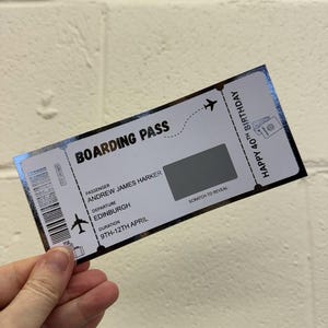 May include: A boarding pass with the text "BOARDING PASS" and "HAPPY 40TH BIRTHDAY". The passenger's name is Andrew James Harker, departing from Edinburgh from the 9th to the 12th of April. There is a scratch-off area.