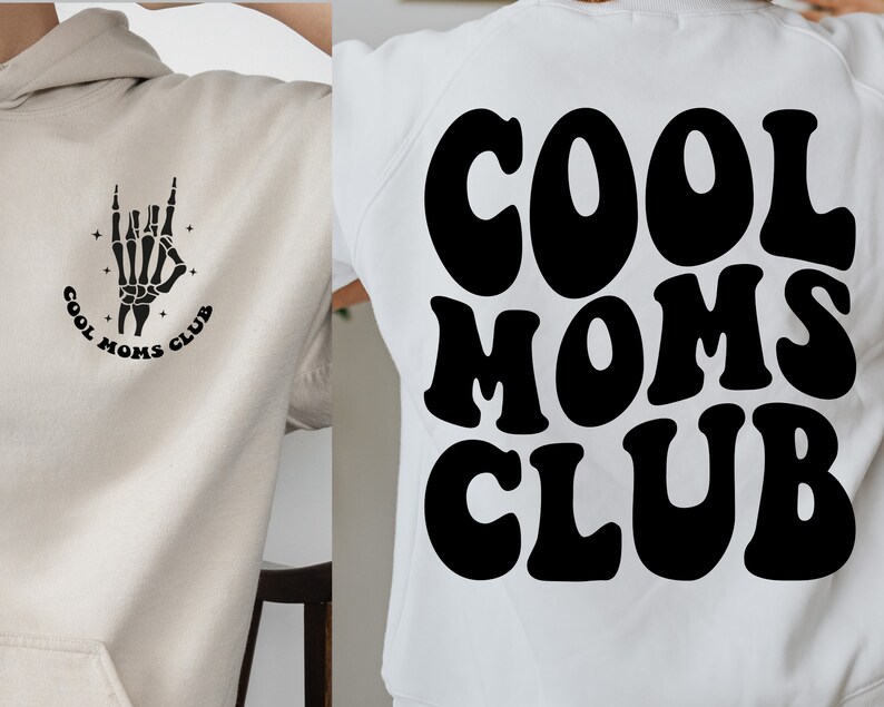 May include: Two white hoodies with black graphic designs. One hoodie features a skeleton hand with the text "Cool Moms Club". The other hoodie features the text "Cool Moms Club" in a retro font.