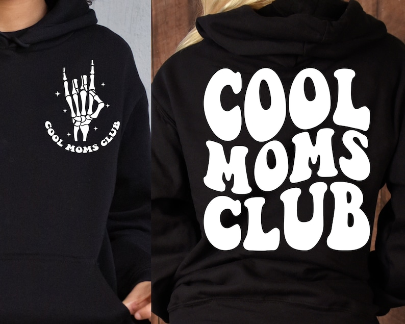 May include: Black hoodie with a white graphic on the front of a skeleton hand making a rock and roll sign with the text "Cool Moms Club" and the same text in white on the back in a retro font.