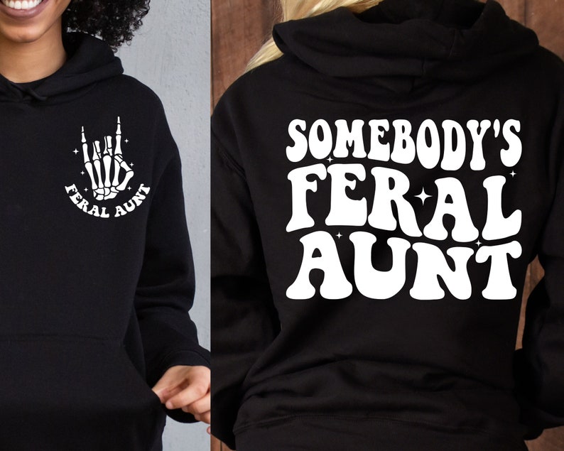 May include: Black hooded sweatshirt with white text that reads "Somebody's Feral Aunt" on the back and a white skeleton hand with the text "Feral Aunt" on the front.