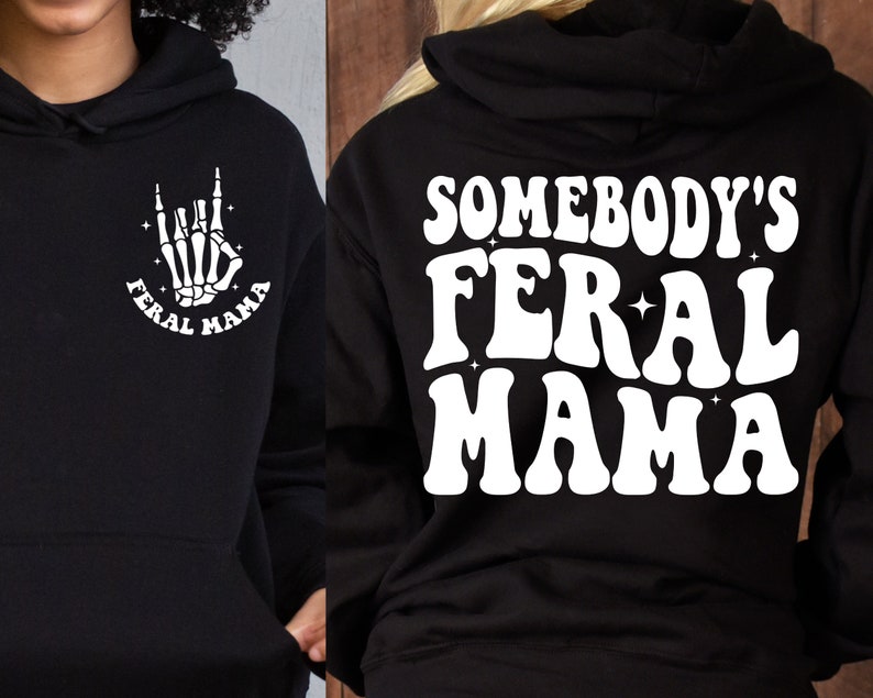 May include: Black hoodie with a white graphic on the front that says "Feral Mama" with a skeleton hand making the rock and roll sign. The back of the hoodie has a white graphic that says "Somebody's Feral Mama".