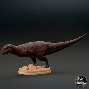 May include: A red-brown dinosaur figurine with a textured surface, standing on a tan-coloured base with small rocks. The dinosaur has a long tail and a long neck.