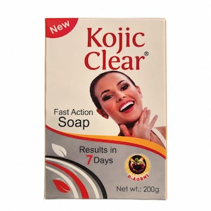 May include: A rectangular box of Kojic Clear soap with a net weight of 200g. The packaging features a smiling person, the text New, Kojic Clear, Fast Action Soap, Results in 7 Days, and a circular logo with a plant graphic and the text D-AGRNI.