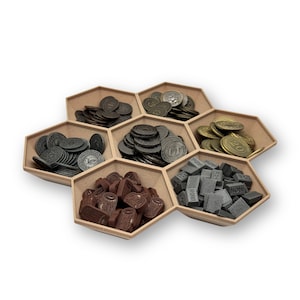 May include: A hexagonal wooden tray with six compartments, each filled with different game pieces. The compartments contain brown, gray, and gold coins, as well as small brown wooden pieces and gray rectangular pieces with the word "IRON" printed on them.