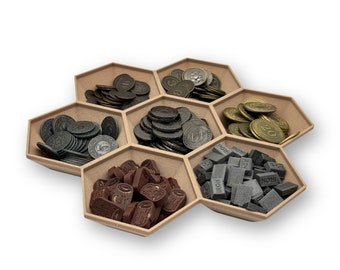 May include: A hexagonal wooden tray with six compartments, each filled with different game pieces. The compartments contain brown, gray, and gold coins, as well as small brown wooden pieces and gray rectangular pieces with the word "IRON" printed on them.