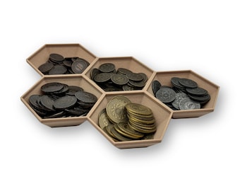 May include: A hexagonal tray with six compartments, each filled with a different type of coin. The coins are all silver or gold in color and have various designs.