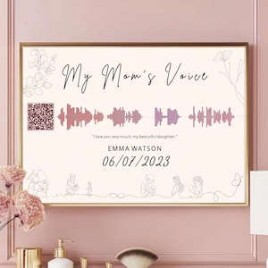 Puede incluir: Impresión enmarcada con el texto "My Mom's Voice" y un gráfico de onda de sonido. La impresión incluye la cita "I love you very much, my beautiful daughter." y el nombre EMMA WATSON con la fecha 06/07/2023. Un código QR está en la esquina superior izquierda.