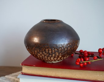 Dark brown carved round ceramic vase