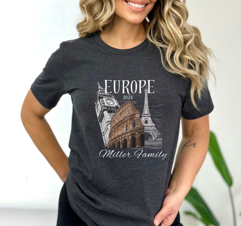 May include: A dark gray t-shirt with a white graphic design featuring iconic European landmarks, including Big Ben, the Colosseum, and the Eiffel Tower. The text "Europe 2024 Miller Family" is printed below the landmarks.