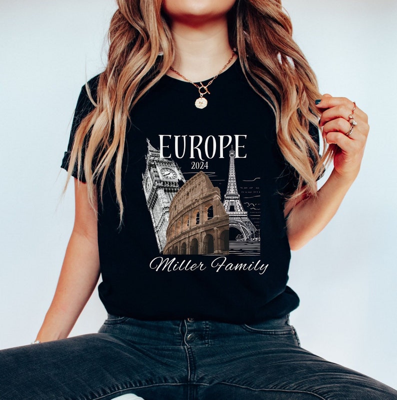 May include: Black t-shirt with a white graphic of iconic European landmarks, including Big Ben, the Colosseum, and the Eiffel Tower. The text "Europe 2024 Miller Family" is printed below the landmarks.