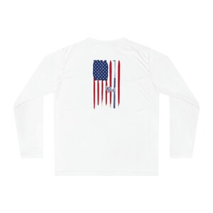 May include: White long-sleeve shirt with a distressed American flag design and a fishing rod and reel on the back.
