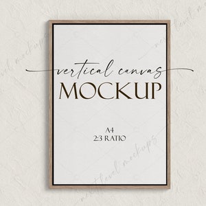 May include: A vertical canvas mockup with a wooden frame. The canvas is white and has the text "vertical canvas MOCKUP" and "A4 2:3 RATIO" printed on it.