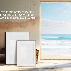 May include: Two white picture frames with a grid pattern are leaning against a wall. The frames are in front of a window with a view of a beach and ocean. The text "GET CREATIVE WITH LEANING FRAMES & GLASS REFLECTIONS" is on the wall.