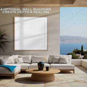 May include: A white sectional sofa with blue throw blanket sits on a light brown tiled floor in a modern living room with a large window overlooking a scenic ocean view. The text "4 OPTIONAL WALL SHADOWS CREATE DEPTH & REALISM" is displayed above a framed white canvas.