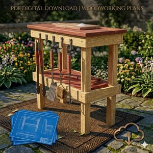 May include: A wooden outdoor grilling station with a red-brown top and a lower shelf. It features hooks for hanging grilling tools, including tongs, a spatula, and a brush. The image includes blueprints and the text "PDF DIGITAL DOWNLOAD | WOODWORKING PLANS".