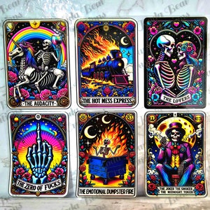 May include: Six tarot cards with a black background and colorful illustrations. The cards are titled "The Audacity", "The Hot Mess Express", "The Lovers", "The Zero of Fucks", "The Emotional Dumpster Fire", and "The Joker The Smoker, The Midnight Toker".
