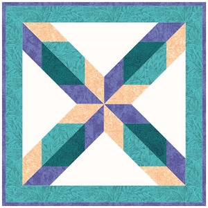 May include: A quilt block featuring a starburst design in shades of teal, purple, and peach. The block is surrounded by a teal border with a floral pattern.