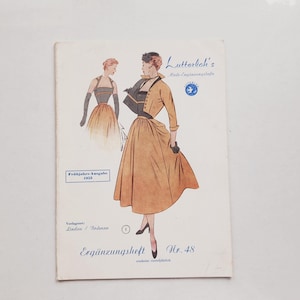 May include: A vintage Lutterloh's Mode-Ergänzungshefte sewing pattern booklet from the 1953 spring edition, number 48. The cover features a fashion illustration of a person wearing a yellow skirt and jacket, with text including Verlagsort Lindau.