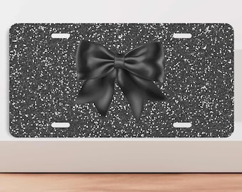 Matrícula frontal con lazo negro sobre fondo negro con efecto brillante, matrícula personalizada, bonitos accesorios para el coche de mujer, regalo para coche nuevo.