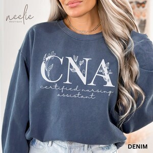 CNA Sweatshirt Comfort Colors® Certified Nursing Assistant Flower Letters Crewneck Sweater, Gift for CNA Appreciation Graduation Present
